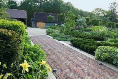 Brick path laid to camber with slot drains either side